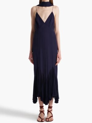 This new, stylish, high-end Khaite slip dress is available in navy and blue, featuring a long design, silk fabric, and a V-neck.