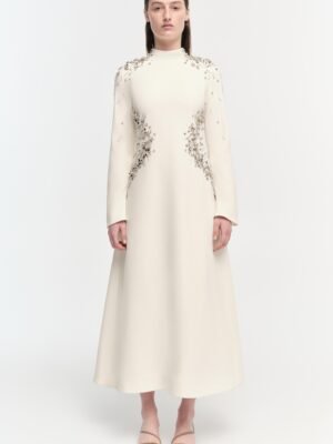 The Simkhai dress is long and inlaid with brick and stone